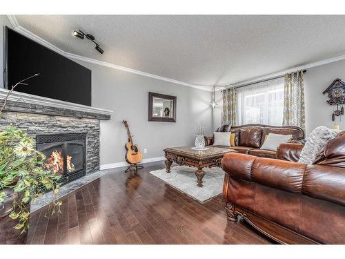 275 Chapalina Terrace Se, Calgary, AB - Indoor Photo Showing Living Room With Fireplace