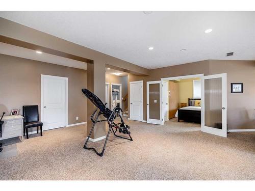 2720 Coopers Manor Sw, Airdrie, AB - Indoor Photo Showing Gym Room