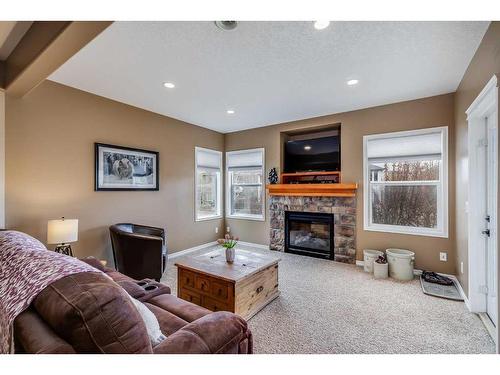 2720 Coopers Manor Sw, Airdrie, AB - Indoor With Fireplace