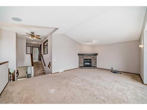 33 Springbank Rise Sw, Calgary, AB - Indoor Photo Showing Living Room With Fireplace
