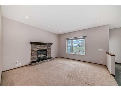 33 Springbank Rise Sw, Calgary, AB - Indoor Photo Showing Living Room With Fireplace