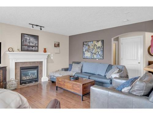 73 Bridlecrest Court Sw, Calgary, AB - Indoor Photo Showing Living Room With Fireplace