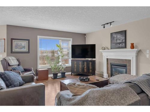 73 Bridlecrest Court Sw, Calgary, AB - Indoor Photo Showing Living Room With Fireplace