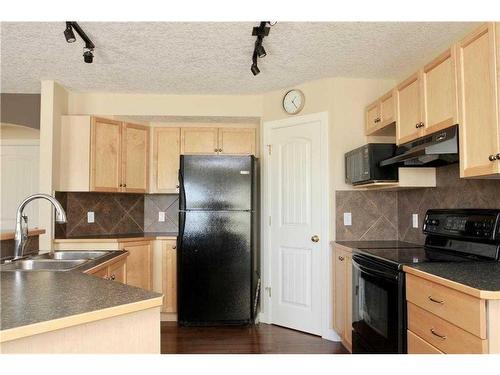 73 Bridlecrest Court Sw, Calgary, AB - Indoor Photo Showing Kitchen With Double Sink