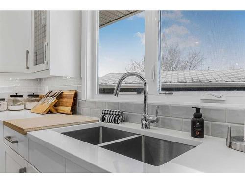 108 Cantree Place Sw, Calgary, AB - Indoor Photo Showing Kitchen With Double Sink