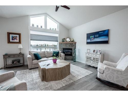 1413 Sunshine Place Se, High River, AB - Indoor Photo Showing Living Room With Fireplace