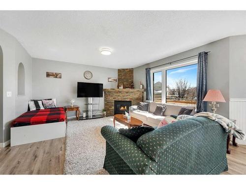 994 Coventry Drive Ne, Calgary, AB - Indoor Photo Showing Living Room With Fireplace