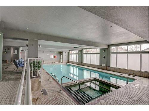 179-15 Everstone Drive Sw, Calgary, AB - Indoor Photo Showing Other Room With In Ground Pool