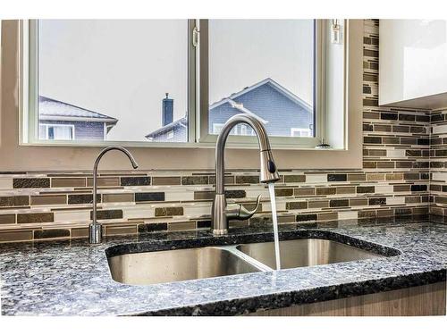 120 Taracove Crescent Ne, Calgary, AB - Indoor Photo Showing Kitchen With Double Sink