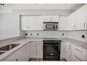 1104-188 15 Avenue Sw, Calgary, AB  - Indoor Photo Showing Kitchen With Double Sink 