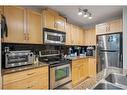 2417-5605 Henwood Street Sw, Calgary, AB  - Indoor Photo Showing Kitchen With Double Sink 
