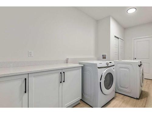 13 Drake Landing Square, Okotoks, AB - Indoor Photo Showing Laundry Room