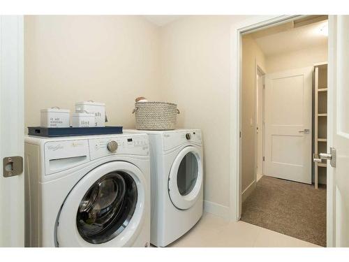 2 Fireside Point, Cochrane, AB - Indoor Photo Showing Laundry Room
