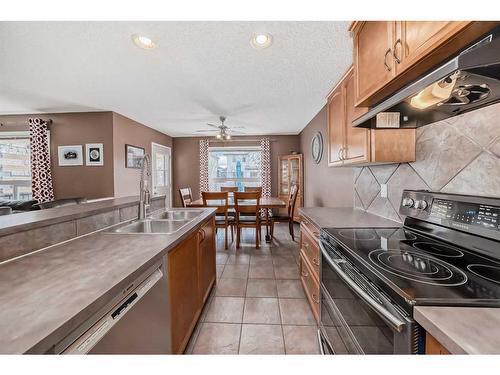 100 Cranfield Circle Se, Calgary, AB - Indoor Photo Showing Kitchen With Double Sink