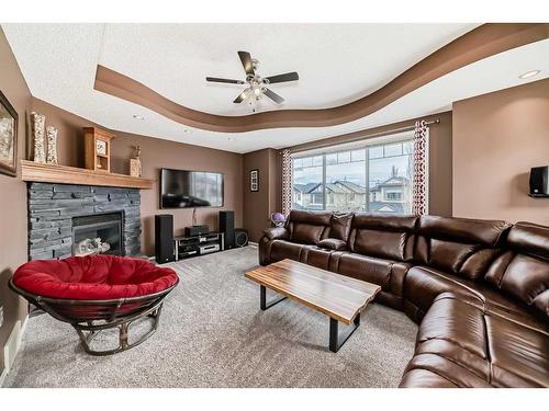100 Cranfield Circle Se, Calgary, AB - Indoor Photo Showing Living Room With Fireplace