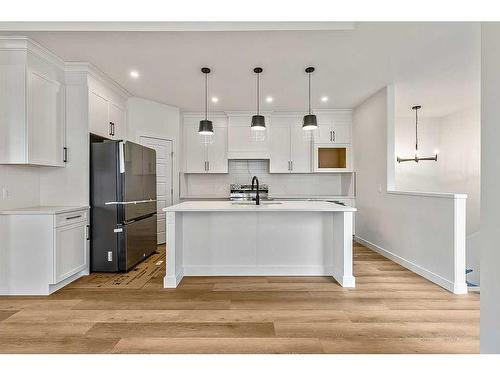 17 Drake Landing Square, Okotoks, AB - Indoor Photo Showing Kitchen With Upgraded Kitchen