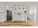 17 Drake Landing Square, Okotoks, AB  - Indoor Photo Showing Kitchen With Upgraded Kitchen 