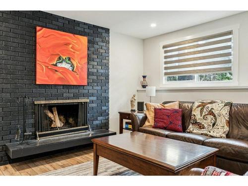 3420 Utah Drive Nw, Calgary, AB - Indoor Photo Showing Living Room With Fireplace