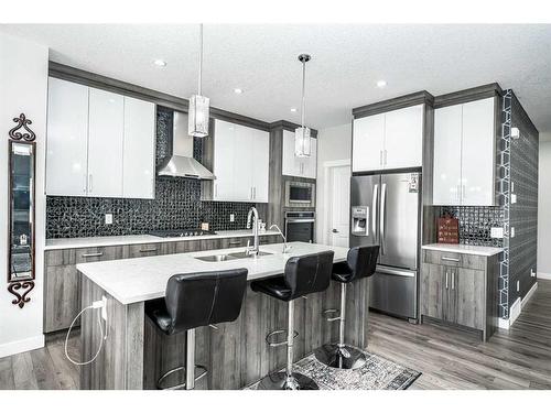 965 Midtown Avenue Sw, Airdrie, AB - Indoor Photo Showing Kitchen With Upgraded Kitchen