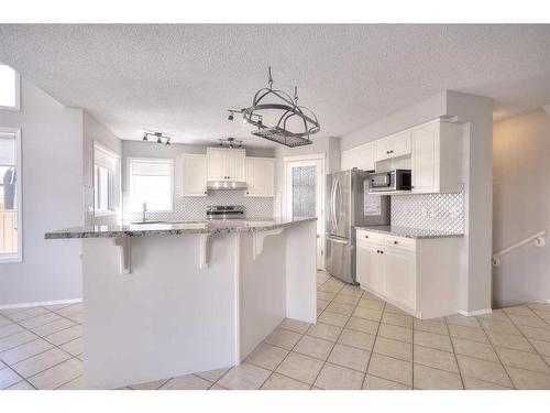 26 Rocky Ridge Circle Nw, Calgary, AB - Indoor Photo Showing Kitchen With Upgraded Kitchen