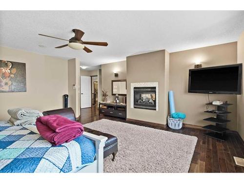 6 Rockcliff Landing Nw, Calgary, AB - Indoor Photo Showing Living Room With Fireplace