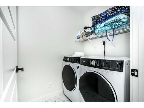 202 Dawson Harbour Rise, Chestermere, AB - Indoor Photo Showing Laundry Room