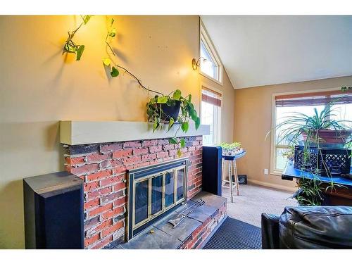325 6 Street, Irricana, AB - Indoor With Fireplace