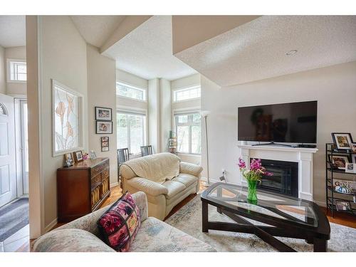 171 Sierra Morena Terrace Sw, Calgary, AB - Indoor Photo Showing Living Room With Fireplace