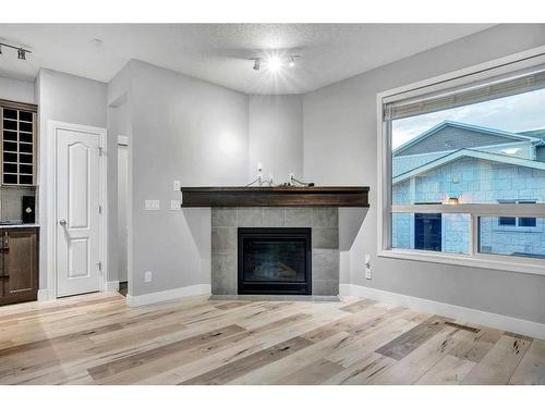 1751 Legacy Circle Se, Calgary, AB - Indoor Photo Showing Living Room With Fireplace