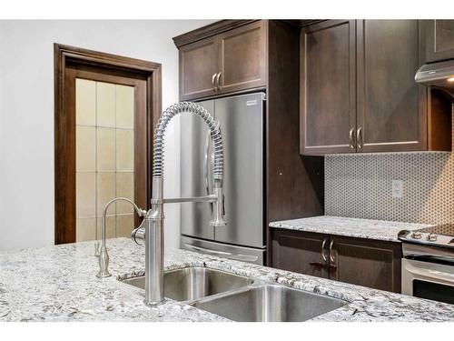 1751 Legacy Circle Se, Calgary, AB - Indoor Photo Showing Kitchen With Stainless Steel Kitchen With Double Sink