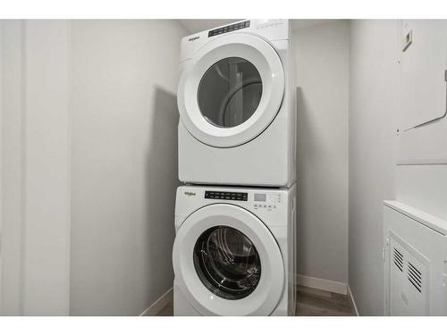 212-150 Shawnee Square Sw, Calgary, AB - Indoor Photo Showing Laundry Room