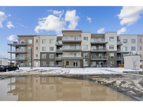 212-150 Shawnee Square Sw, Calgary, AB - Outdoor With Balcony With Facade