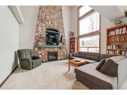 359 Chaparral Drive Se, Calgary, AB - Indoor Photo Showing Living Room With Fireplace