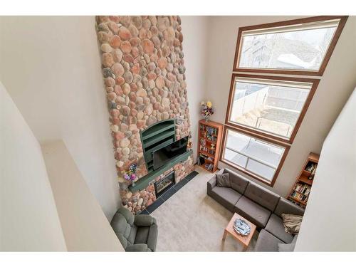 359 Chaparral Drive Se, Calgary, AB - Indoor Photo Showing Other Room With Fireplace