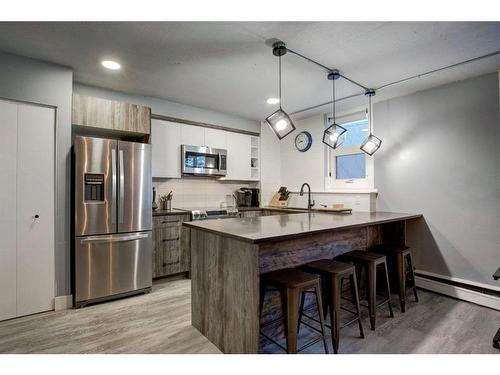 101-1027 Cameron Avenue Sw, Calgary, AB - Indoor Photo Showing Kitchen With Stainless Steel Kitchen With Double Sink