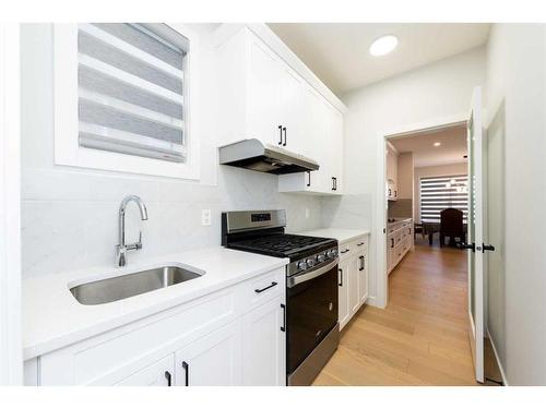 42 Ambleside Rise Nw, Calgary, AB - Indoor Photo Showing Kitchen With Upgraded Kitchen