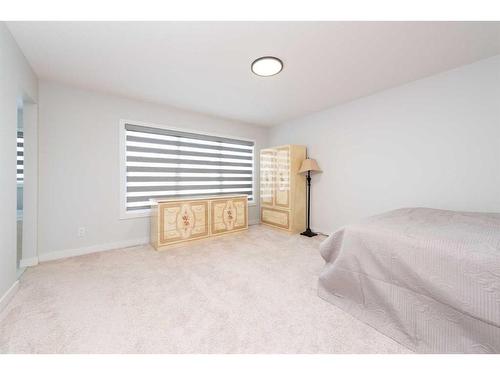 42 Ambleside Rise Nw, Calgary, AB - Indoor Photo Showing Bedroom