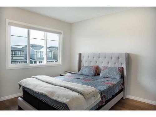 16 Dawson Harbour Villas, Chestermere, AB - Indoor Photo Showing Bedroom