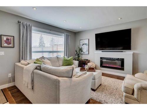 4812 Worcester Drive Sw, Calgary, AB - Indoor Photo Showing Living Room With Fireplace