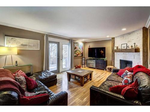 28 Canova Road Sw, Calgary, AB - Indoor Photo Showing Living Room With Fireplace