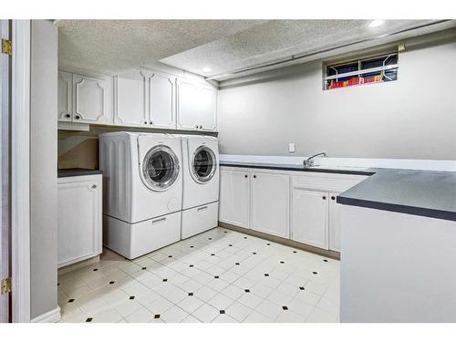 28 Canova Road Sw, Calgary, AB - Indoor Photo Showing Laundry Room