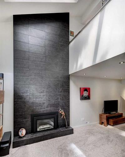 216 Signal Hill Place Sw, Calgary, AB - Indoor With Fireplace