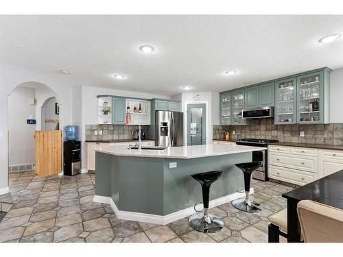 11 Bow Ridge Road, Cochrane, AB - Indoor Photo Showing Kitchen With Upgraded Kitchen