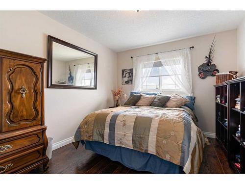 11 Bow Ridge Road, Cochrane, AB - Indoor Photo Showing Bedroom
