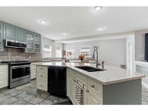 11 Bow Ridge Road, Cochrane, AB - Indoor Photo Showing Kitchen With Double Sink With Upgraded Kitchen
