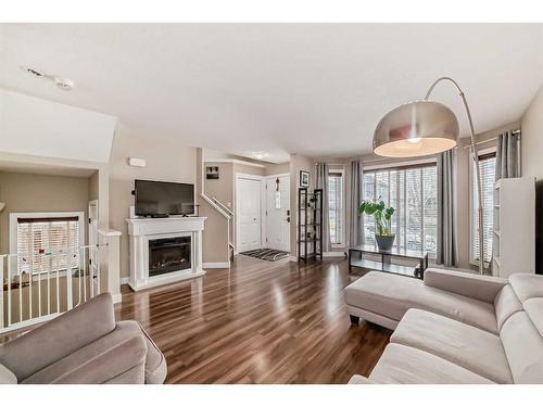 294 Saddlebrook Circle Ne, Calgary, AB - Indoor Photo Showing Living Room With Fireplace