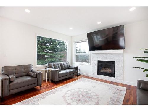 7007 Christie Briar Manor Sw, Calgary, AB - Indoor Photo Showing Living Room With Fireplace
