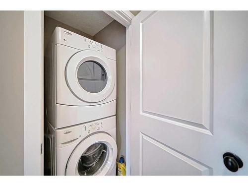 600-413 River Avenue, Cochrane, AB - Indoor Photo Showing Laundry Room