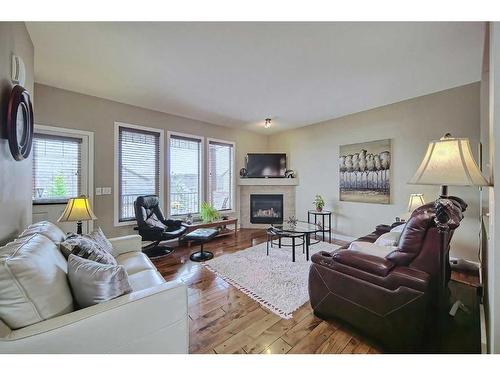 600-413 River Avenue, Cochrane, AB - Indoor Photo Showing Living Room With Fireplace