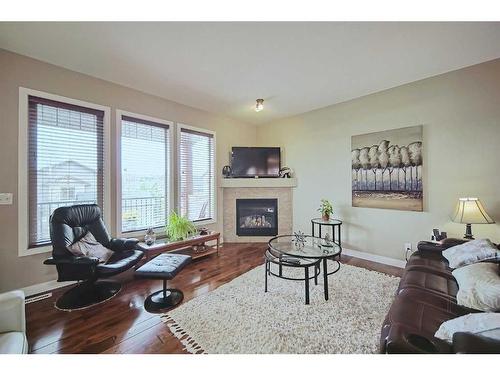 600-413 River Avenue, Cochrane, AB - Indoor Photo Showing Living Room With Fireplace